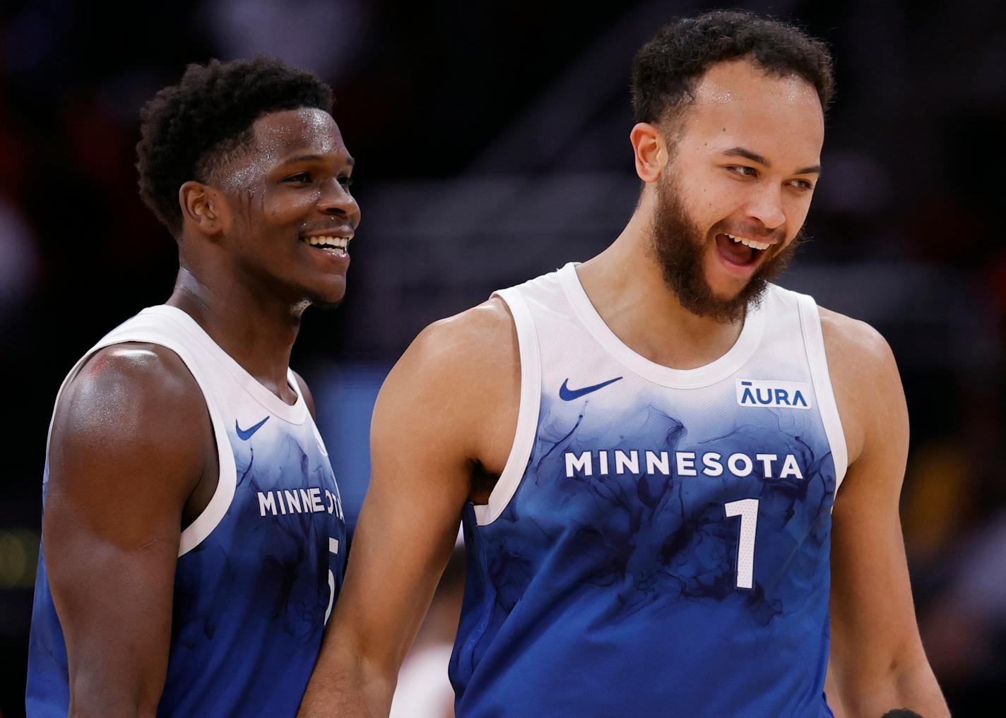 The Minnesota Timberwolves' Kyle Anderson (1) celebrates with teammate Anthony Edwards (5) during a break in second-half action against the Houston Rockets at Toyota Center on Friday, Jan. 5, 2024, in Houston. (Carmen Mandato/Getty Images/TNS) ORG XMIT: 99826647W