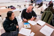 Teacher Christopher Weyandt, right, worked with student Grace Moua during English class at Century College in White Bear Lake on Wednesday, November 6