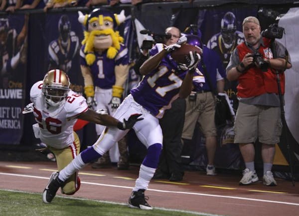 Vikings wide receiver Greg Lewis landed with both feet in the end zone after grabbing a 32-yard touchdown pass from Brett Favre with two seconds remai