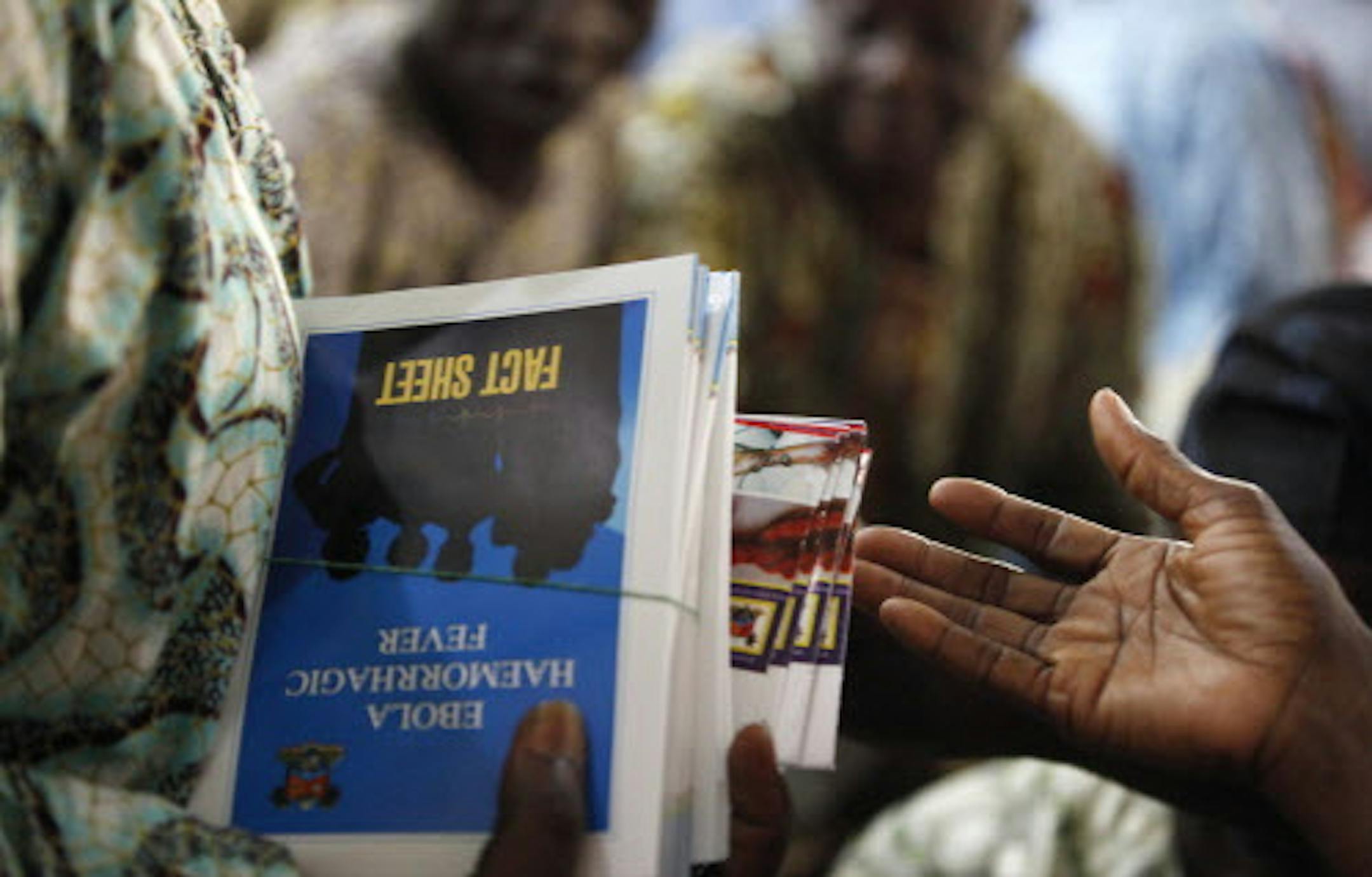 Fact sheets for the Ebola virus are distributed during an awareness campaign in Lagos, Nigeria, Friday, Aug. 15, 2014. The Ebola outbreak that has killed more than 1,000 people in West Africa could last another six months, Doctors Without Borders said Friday, and an aid worker acknowledged that the true death toll is unknown. Meanwhile, new figures released by the World Health Organization showed that Liberia has recorded more deaths ó 413 ó than any of the other affected countries. (A