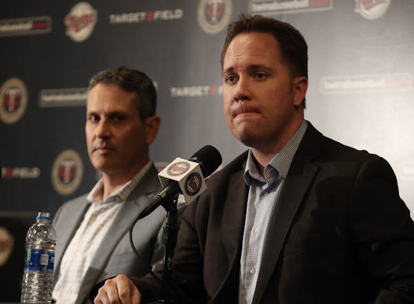 Thad Levine (left) and Derek Falvey have agreed to new deals intended to keep them with the Twins through 2024.