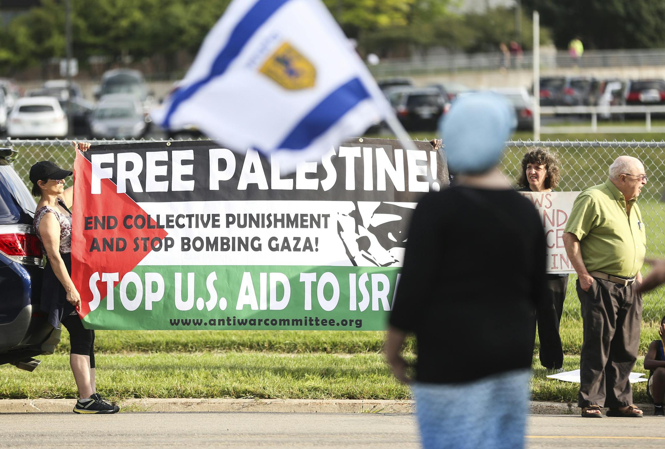 Pro-Palestinian protesters held signs across the street. Dayton assured the pro-Israeli crowd that the United States and Israel “are friends indeed.”
