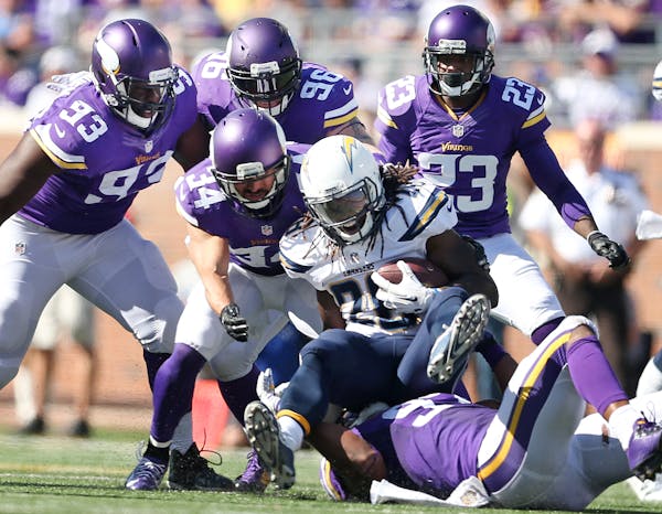 Vikings defenders stopped San Diego Chargers running back Melvin Gordon (28) for no gain in the third quarter Sunday September 27, 2015 in Minneapolis