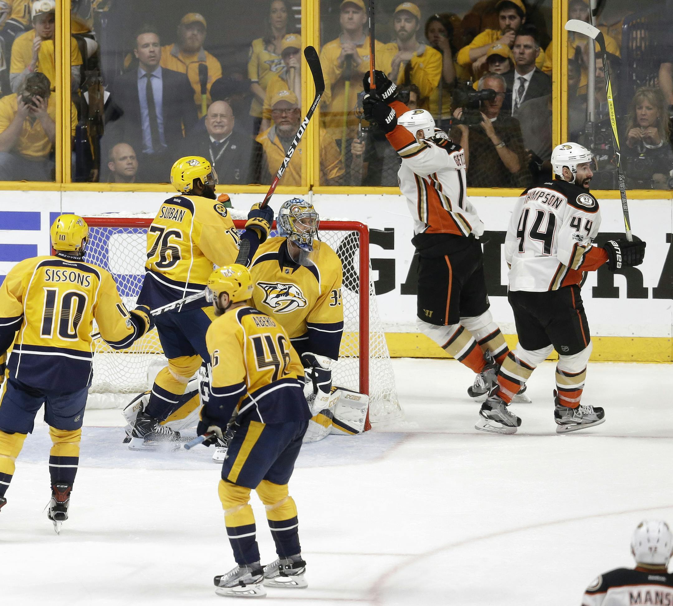 Anaheim Ducks center Nate Thompson (44) and center Ryan Getzlaf, second from right, celebrate after beating the Nashville Predators in overtime in Game 4 of the Western Conference final in the NHL hockey Stanley Cup playoffs Thursday, May 18, 2017, in Nashville, Tenn. The Ducks won 3-2 to even the series 2-2. (AP Photo/Mark Humphrey)