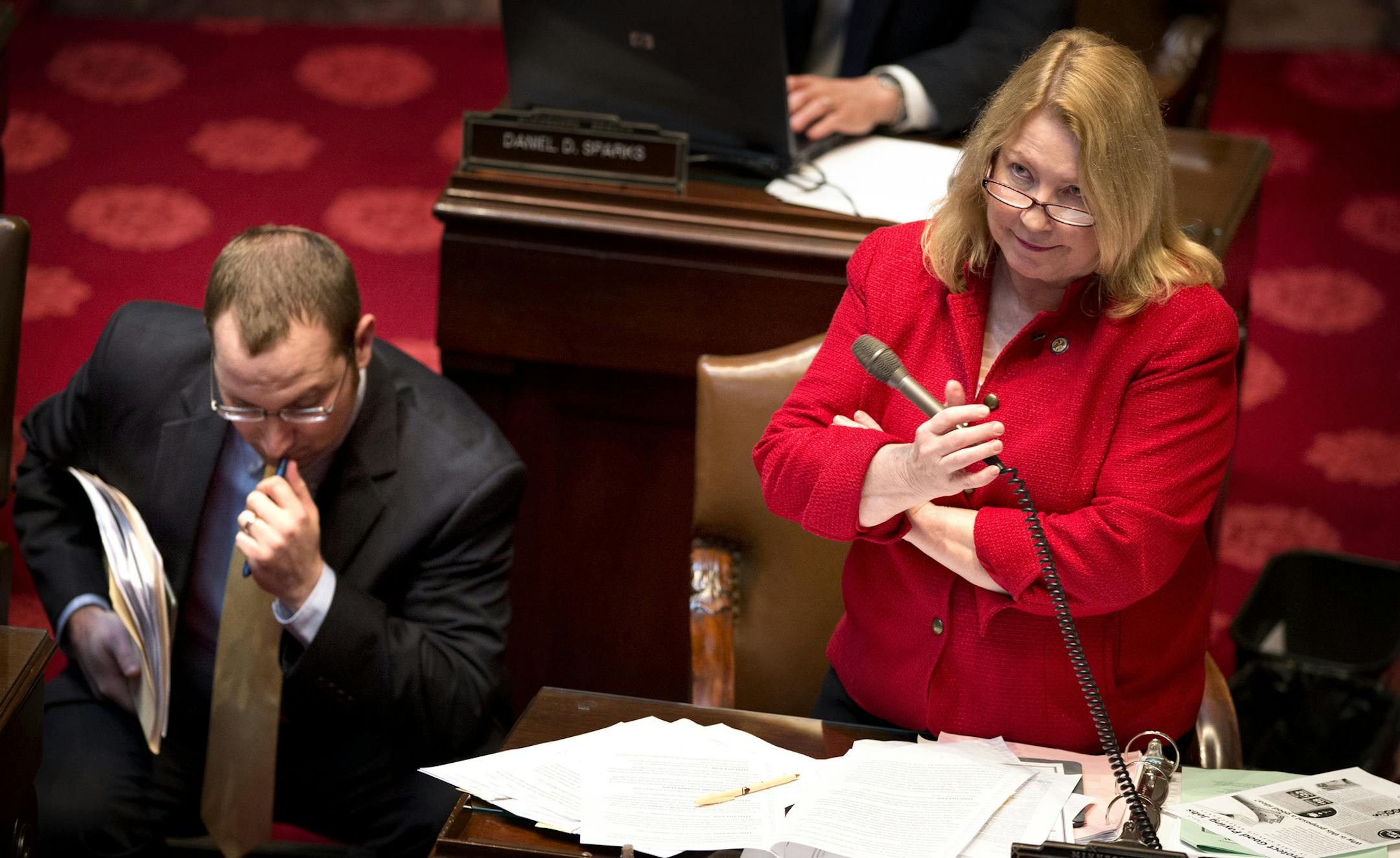 DFL researcher Craig Janezich stood ready to help Sen Chris Eaton as she defended her minimum wage bill from questions and amendments on the Senate floor. Wednesday, May 8, 2013 ] GLEN STUBBE * gstubbe@startribune.com