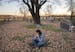 Renee Hentges visits the cemetery every day to commune with the husband and son she will never see again. Hundreds of farmers have come to her aid wit