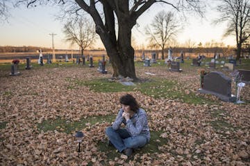 Renee Hentges visits the cemetery every day to commune with the husband and son she will never see again. Hundreds of farmers have come to her aid wit