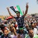 Egyptian Salafis shout slogans against Syrian President Bashar Assad as one waves a Syrian revolutionary flag during a rally after the Friday prayers 