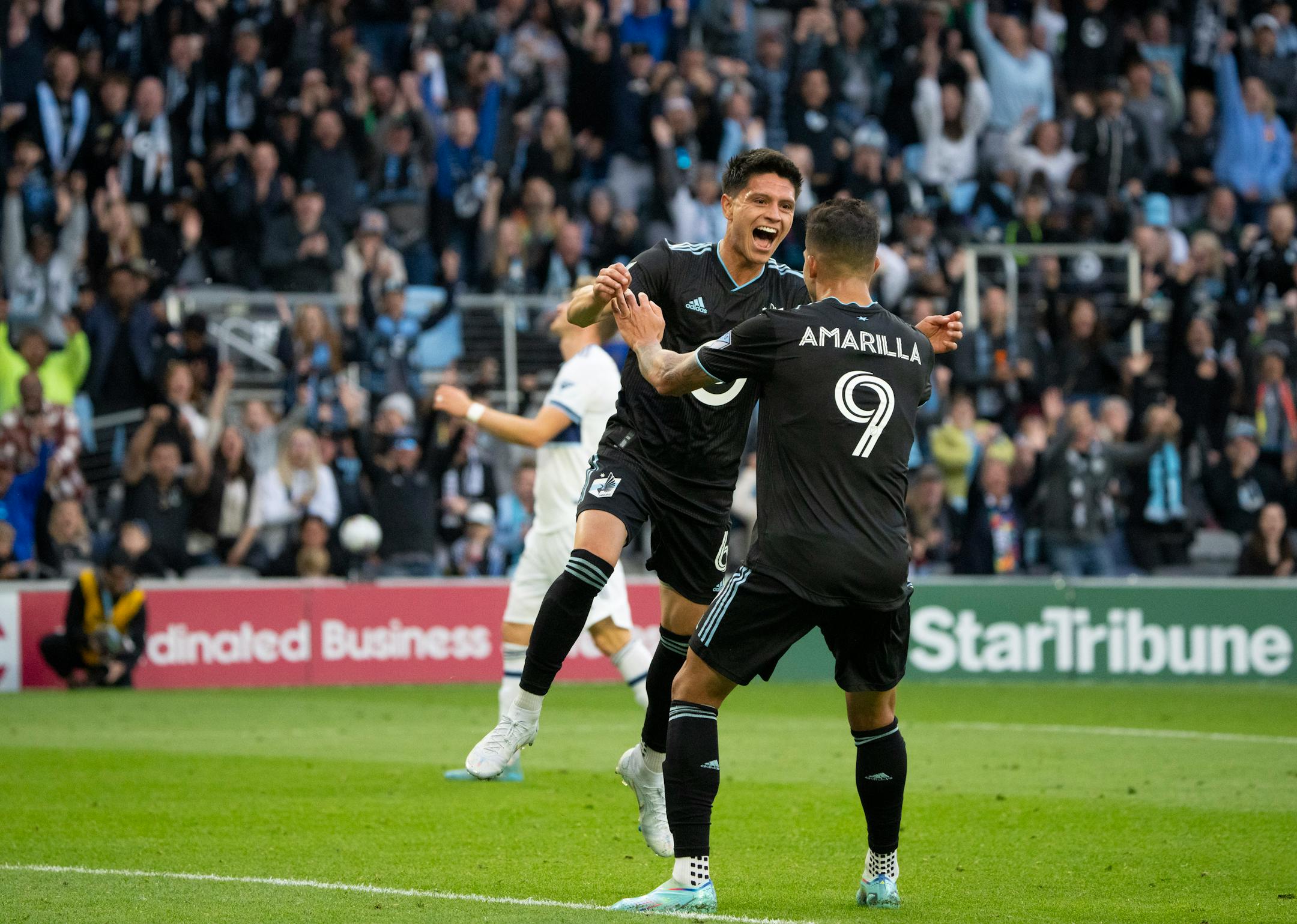 Minnesota United midfielder Jonathan Gonzalez (6) jumped into the arms of teammate Luis Amarilla (9) after he scored on Vancouver Whitecaps goalkeeper Thomas Hasal in the second half of their game.
