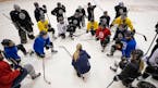 Minnesota Whitecaps co-head coach Ronda Engelhardt spoke to players during an early practice. The team won the NWHL title, but there are questions abo