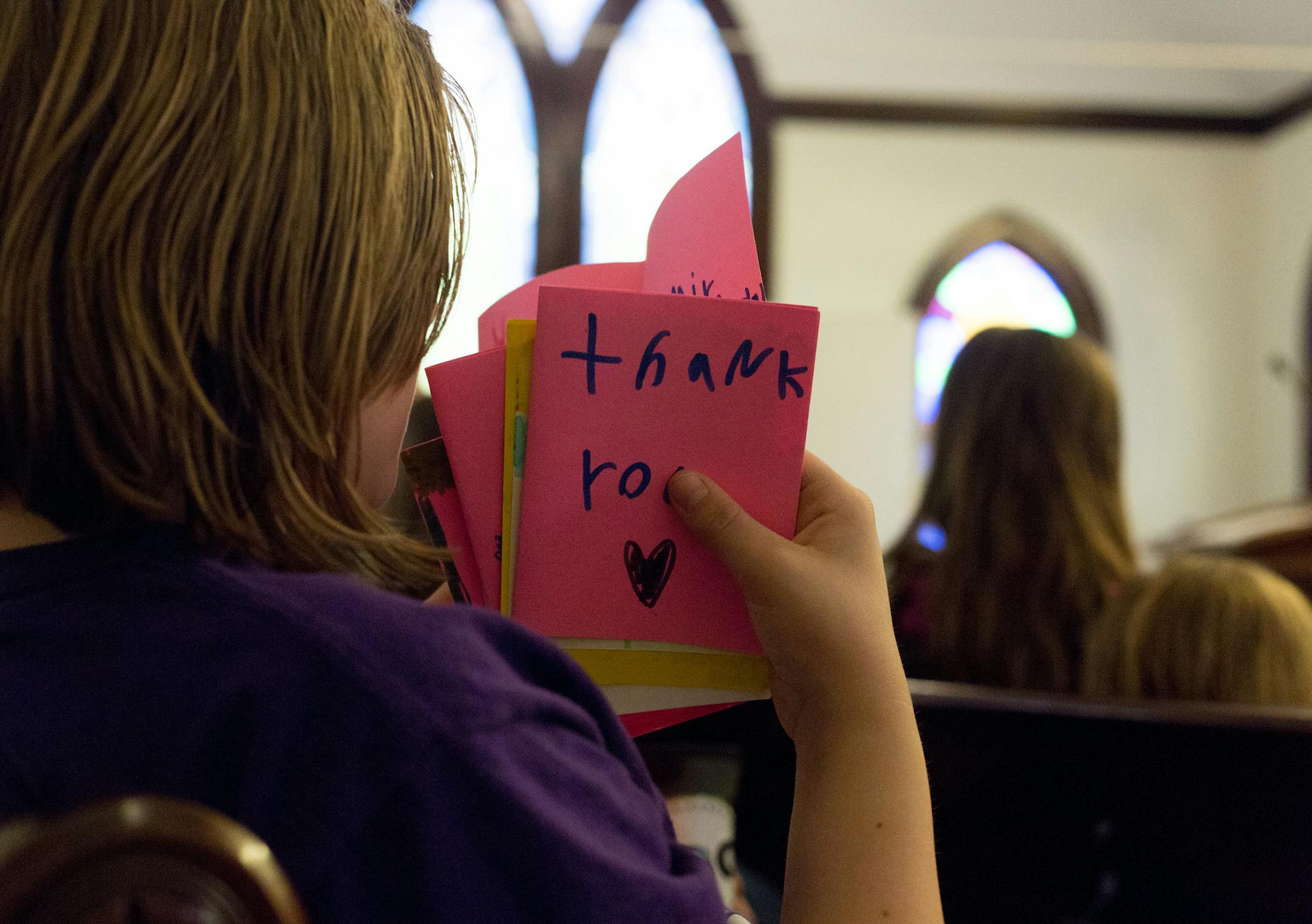 A youth participant of Funky Minds, a local non profit, holds thank you cards for Miranda Nelson, age 16, to thank her for her work in the community and for sharing her story, at Church by the River, Carver MN, Wednesday afternoon. ] Elizabeth Brumley special to the Star Tribune * Miranda was adopted in 2014, and is now using her Junior capstone project to give back by donating to foster children.