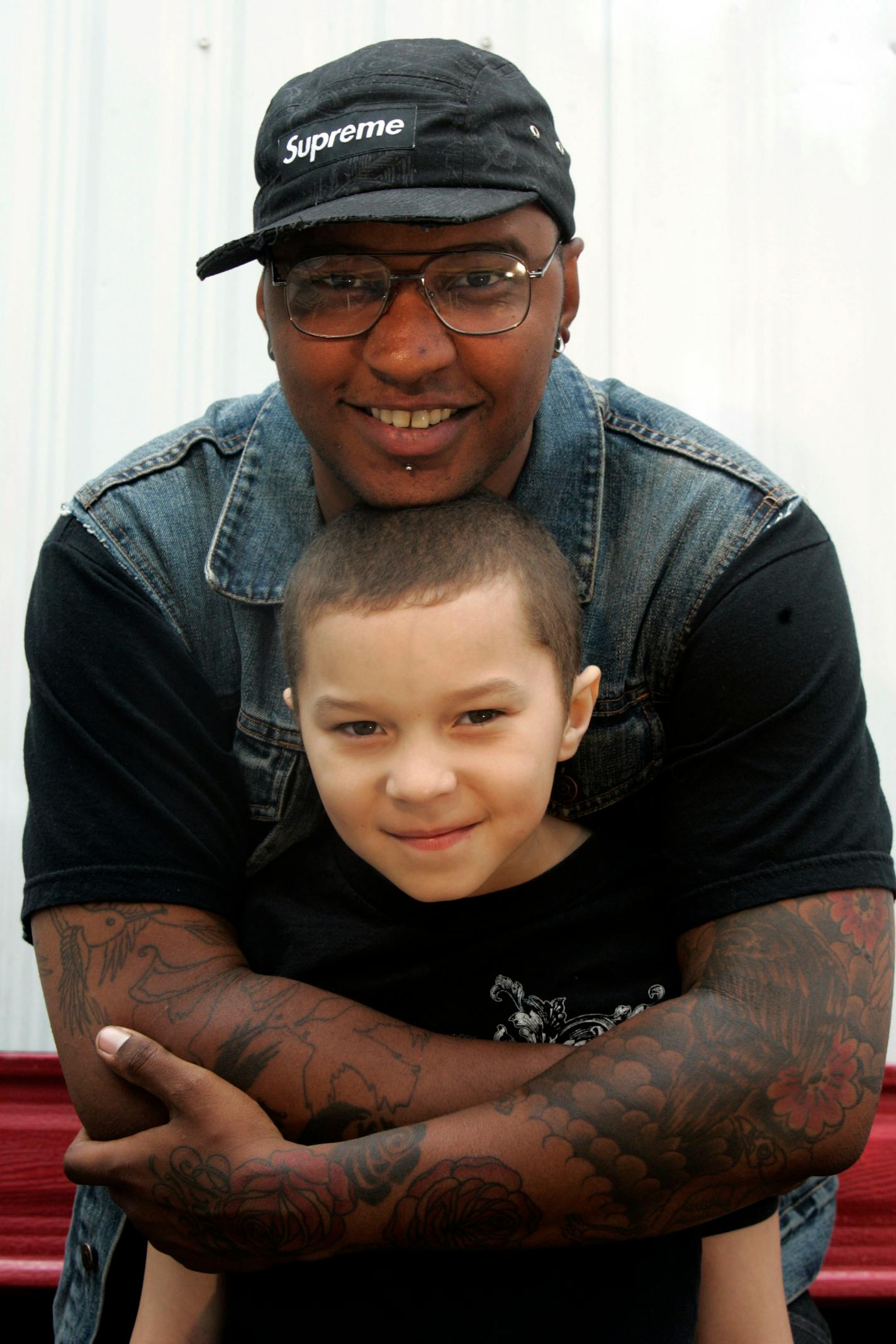 P.O.S. held his son Jake, 8, back stage at the Soundset concert at the Metrodome.