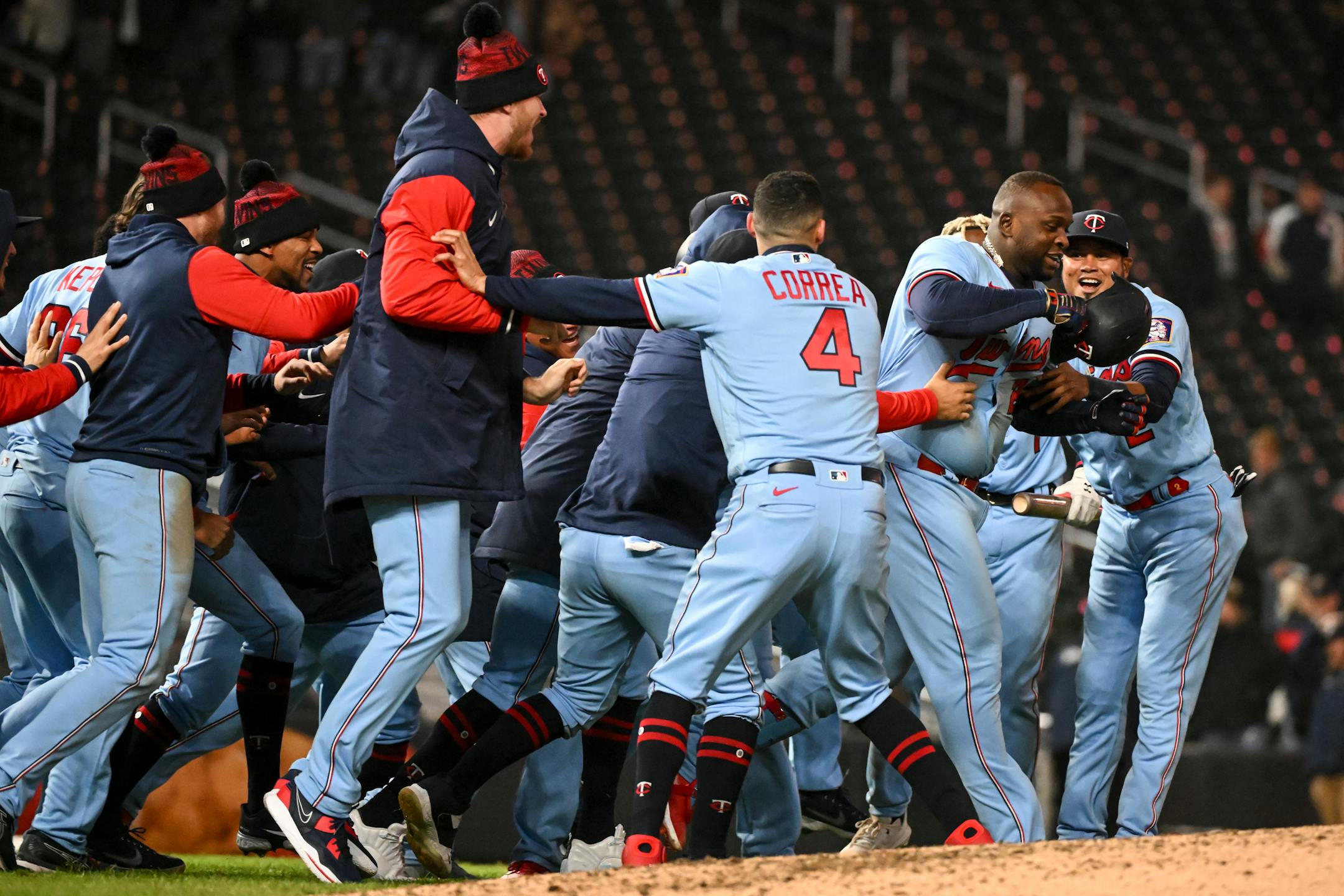 Teammates celebrate with Minnesota Twins first baseman Miguel Sano (22) after his 9th inning single, which lead. to a throwing error and two runs, giving the Twins a 5-4 walk-off victory against the Detroit Tigers.