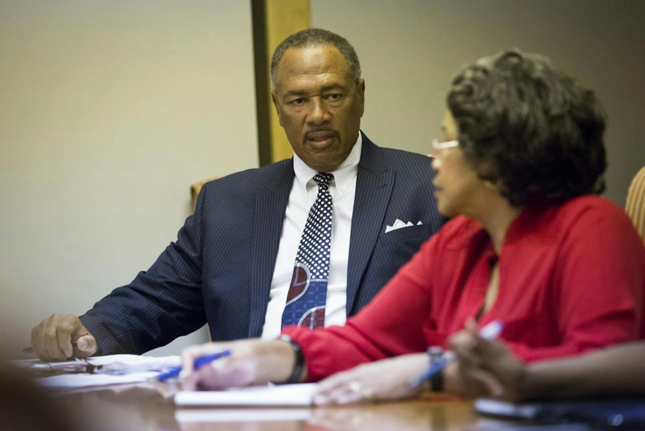 Community Action of Minneapolis chief executive Bill Davis listened during roll call in a board meeting in Minneapolis, Minn., on Tuesday, September 23, 2014.
