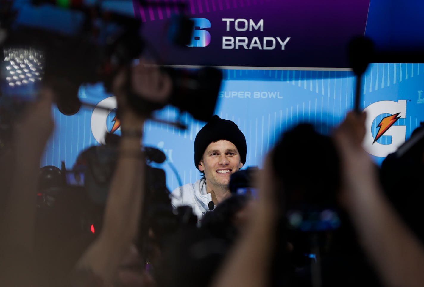 New England Patriots' Tom Brady answers questions during NFL football Super Bowl 52 Opening Night Monday, Jan. 29, 2018, at the Xcel Center in St. Paul, Minn. (AP Photo/Matt Slocum)