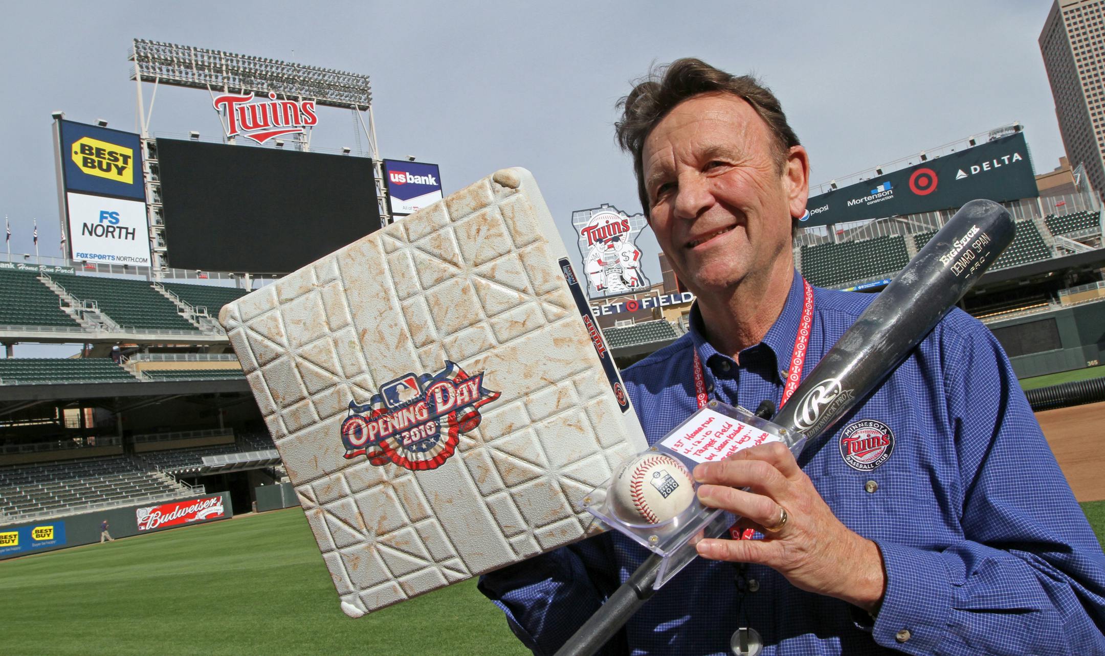 Twins Team Curator Clyde Doepner held first base from the Twins opener in 2010, the ball hit by Jason Kubel for the first regular season home run and the bat used by Denard Span to hit a home run