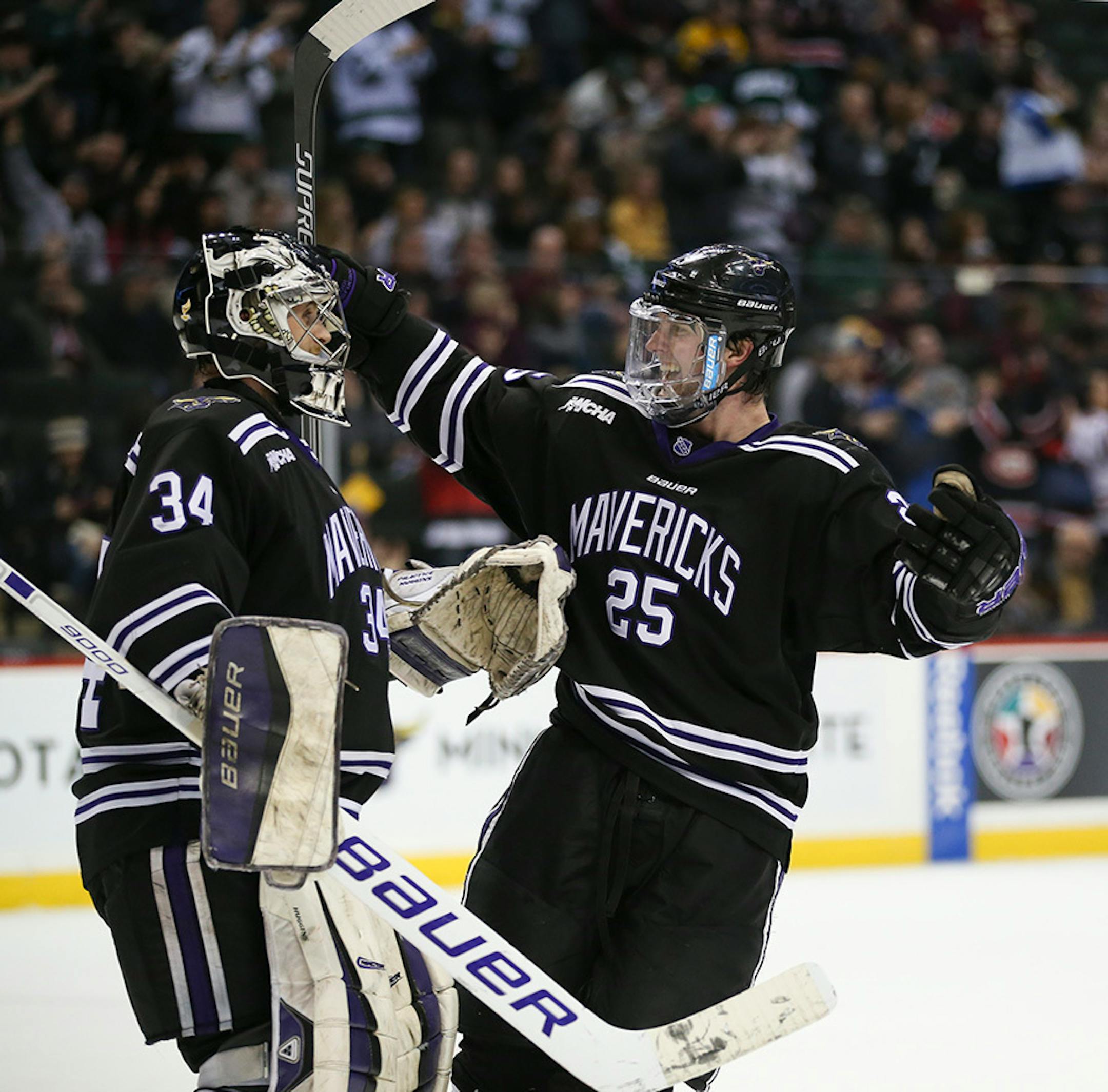 Mavericks forward Zach Stepan (25) was first to congratulate Mavericks goalie Cole Huggins (34) after Mankato's win over the Gophers Sunday afternoon.