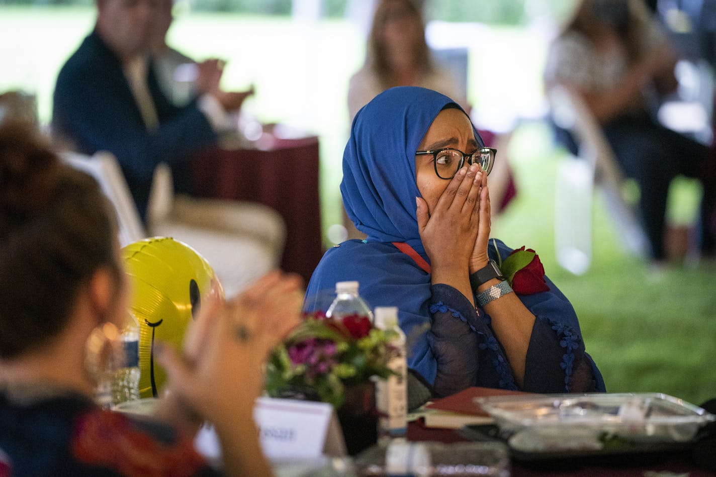 Qorsho Hassan, a fifth grade teacher at Gideon Pond Elementary School in the Burnsville-Eagan-Savage School District, reacts after being named Education Minnesota's 2020 Teacher of the Year during a ceremony at the State Capitol. ] LEILA NAVIDI • leila.navidi@startribune.com BACKGROUND INFORMATION: Education Minnesota's Teacher of the Year ceremony outside the State Capitol in St. Paul on Thursday, August 6, 2020.