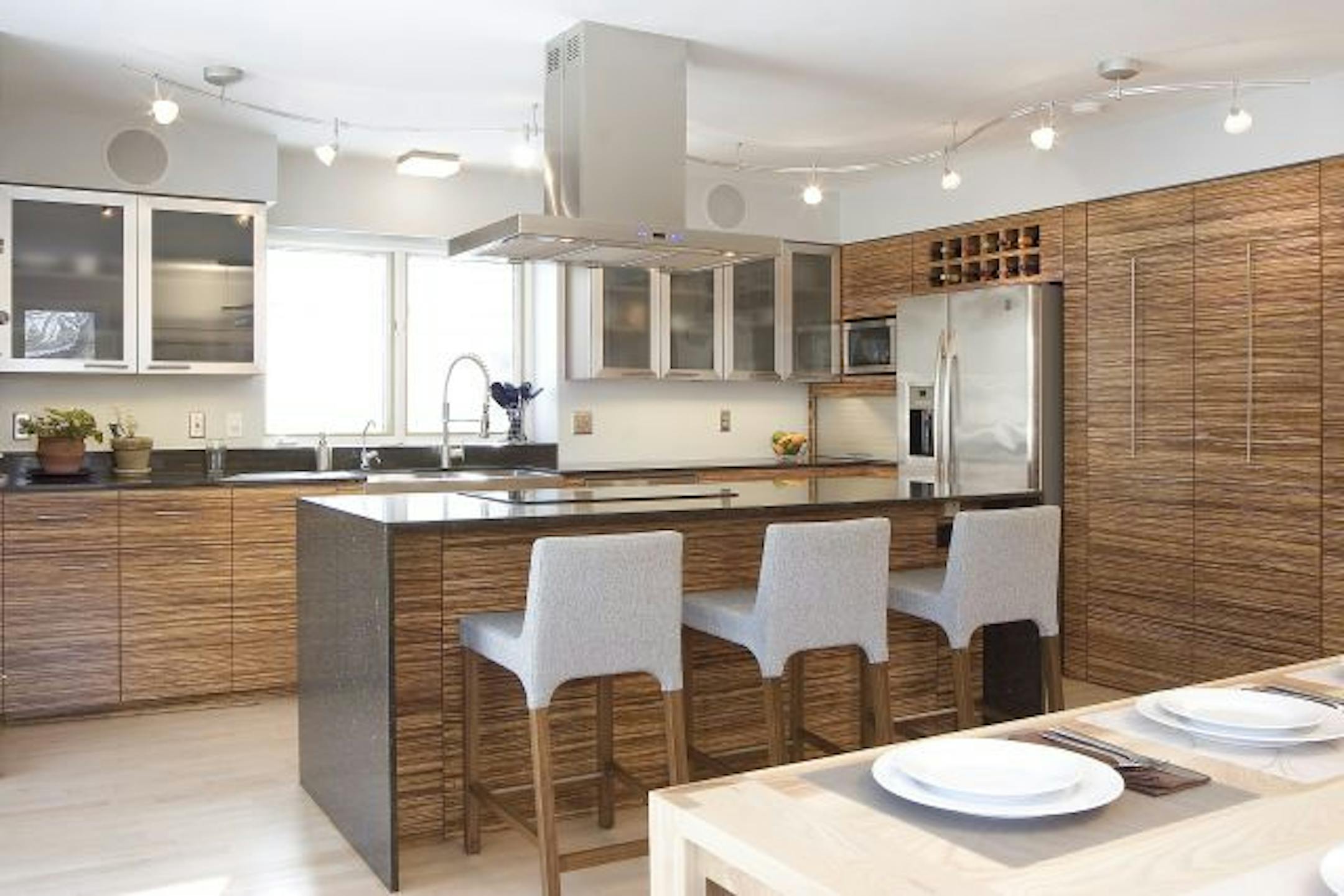 AFTER: The cabinets were refaced with Plyboo, a bamboo plywood material that is a rapidly renewable resource.