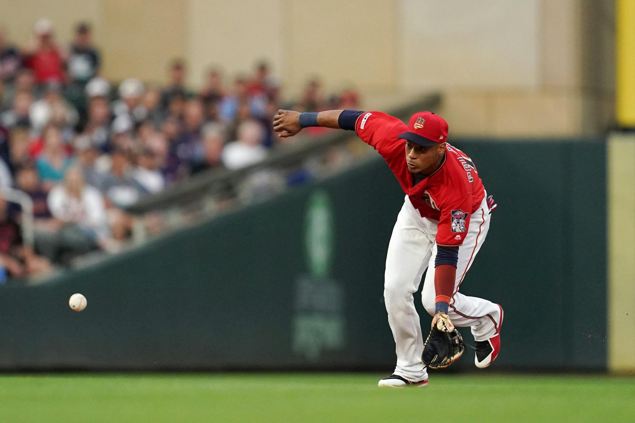 Minnesota Twins shortstop Jorge Polanco (11) fielded a ball hit by Texas Rangers center fielder Delino DeShields (3) in the first inning.
