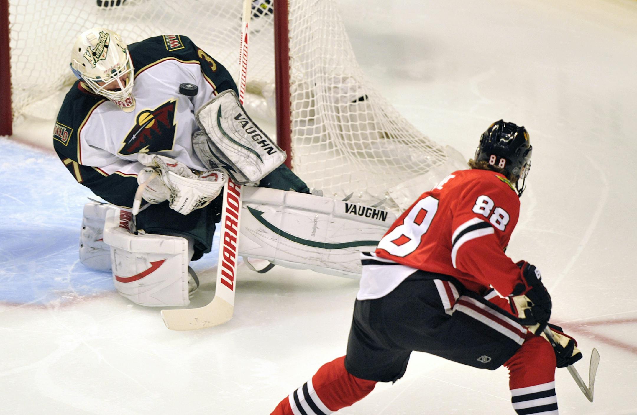 Josh Harding stops a shot by Chicago Blackhawks' Patrick Kane during the second period of Game 1 of an NHL Stanley Cup playoff series