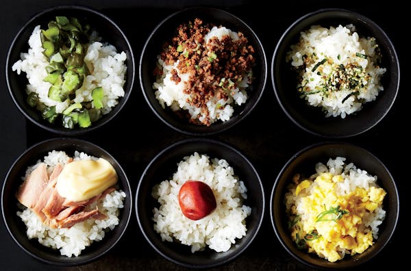 Toppings for rice include, from top left, pickled cucumber, Soboro beef, Furikake seasoning, and, from bottom left, tuna and mayo,
pickled plum, and s