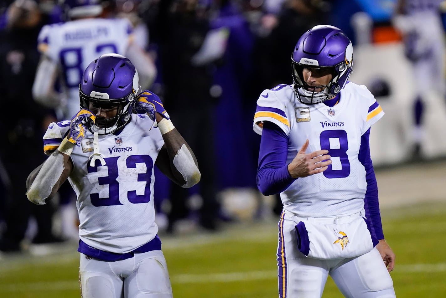 Minnesota Vikings quarterback Kirk Cousins reacts in front of teammate running back Dalvin Cook