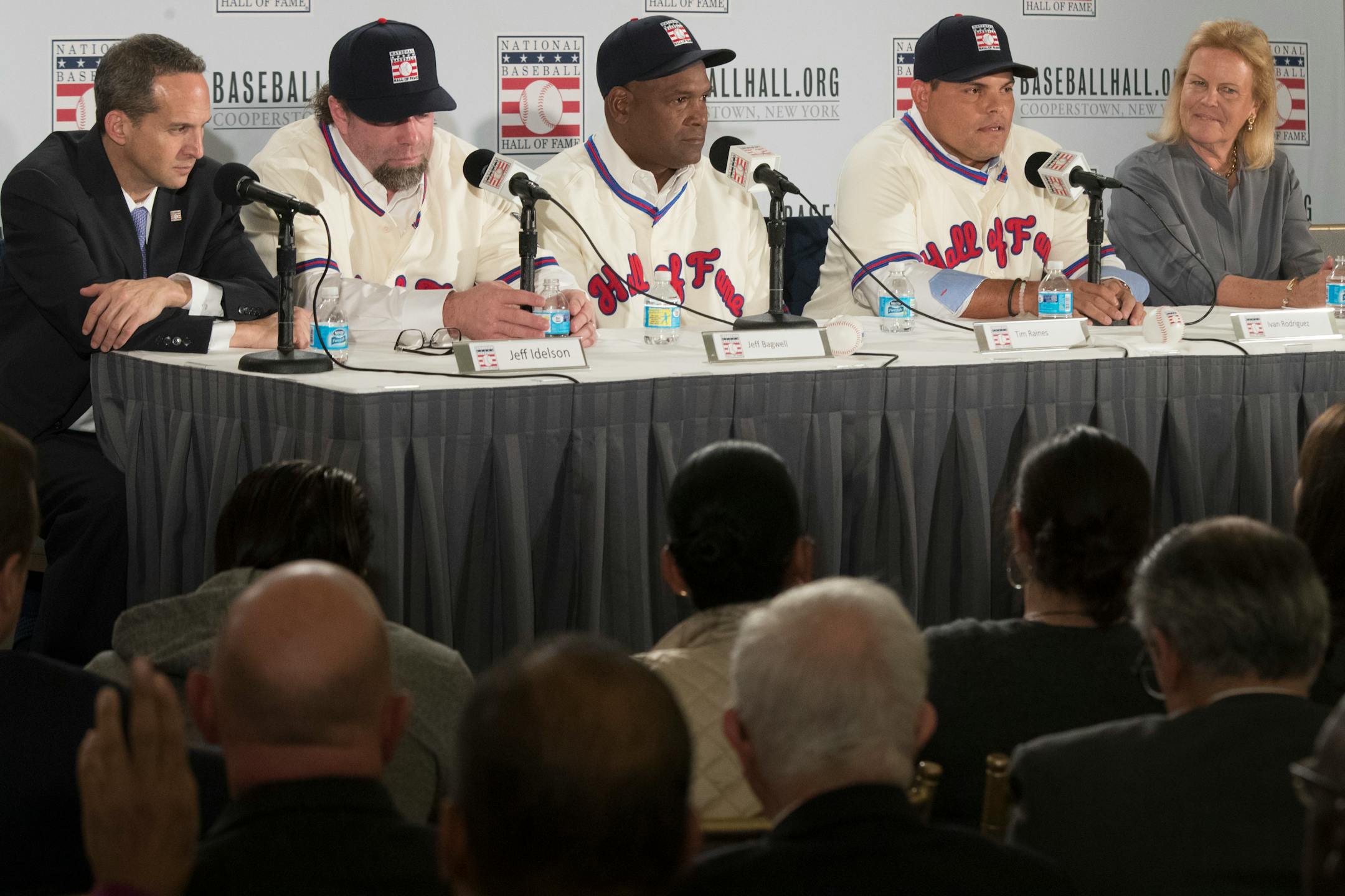 Newly elected baseball Hall of Fame inductees Jeff Bagwell, second from left, Tim Raines, third from left, and Ivan Rodriguez, second from right, are joined by President of the National Baseball Hall of Fame and Museum Jeff Idelson, left, and Chairman of the Board of Directors Jane Forbes Clark as they take part in a news conference Thursday in New York.