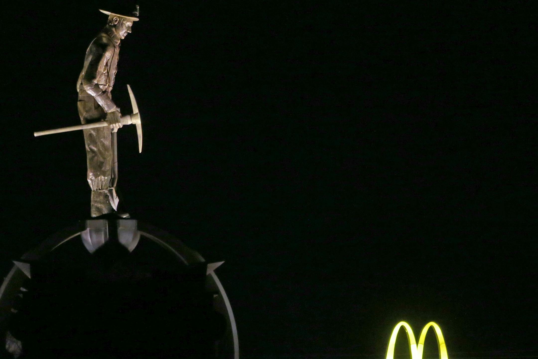 The Iron Man Memorial, 85 feet tall, looms large in Chisholm, Minn., as does the mining legacy.