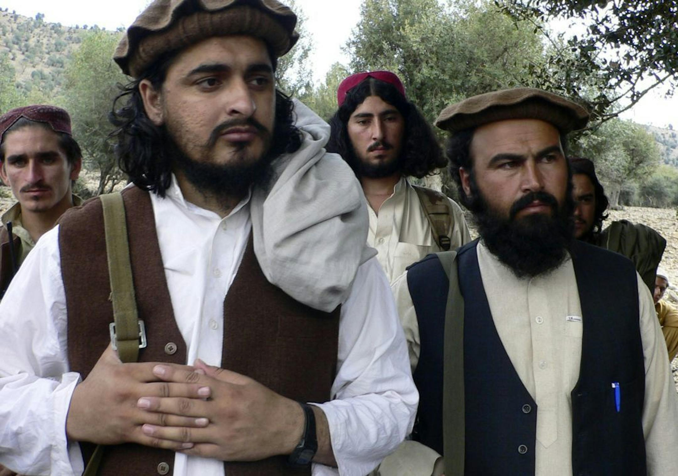 FILE - In this Oct. 4, 2009 file photo, Pakistani Taliban chief Hakimullah Mehsud, left, is seen with his comrade Waliur Rehman.