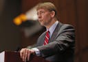 FILE - In this March 26, 2015, file photo, Consumer Financial Protection Bureau Director Richard Cordray speaks during a panel discussion in Richmond,