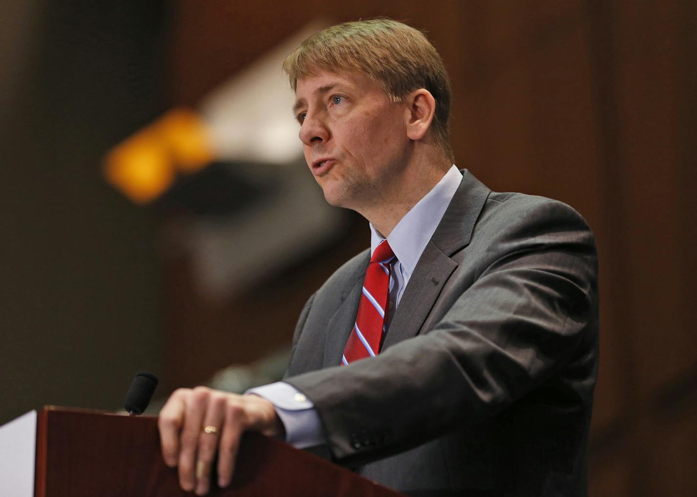 FILE - In this March 26, 2015, file photo, Consumer Financial Protection Bureau Director Richard Cordray speaks during a panel discussion in Richmond, Va. The CFPB is proposing a ban on arbitration clauses, which would impact the entire financial industry encompassing hundreds of millions of bank accounts, credit cards and mortgages. (AP Photo/Steve Helber, File) ORG XMIT: MIN2016061517340347