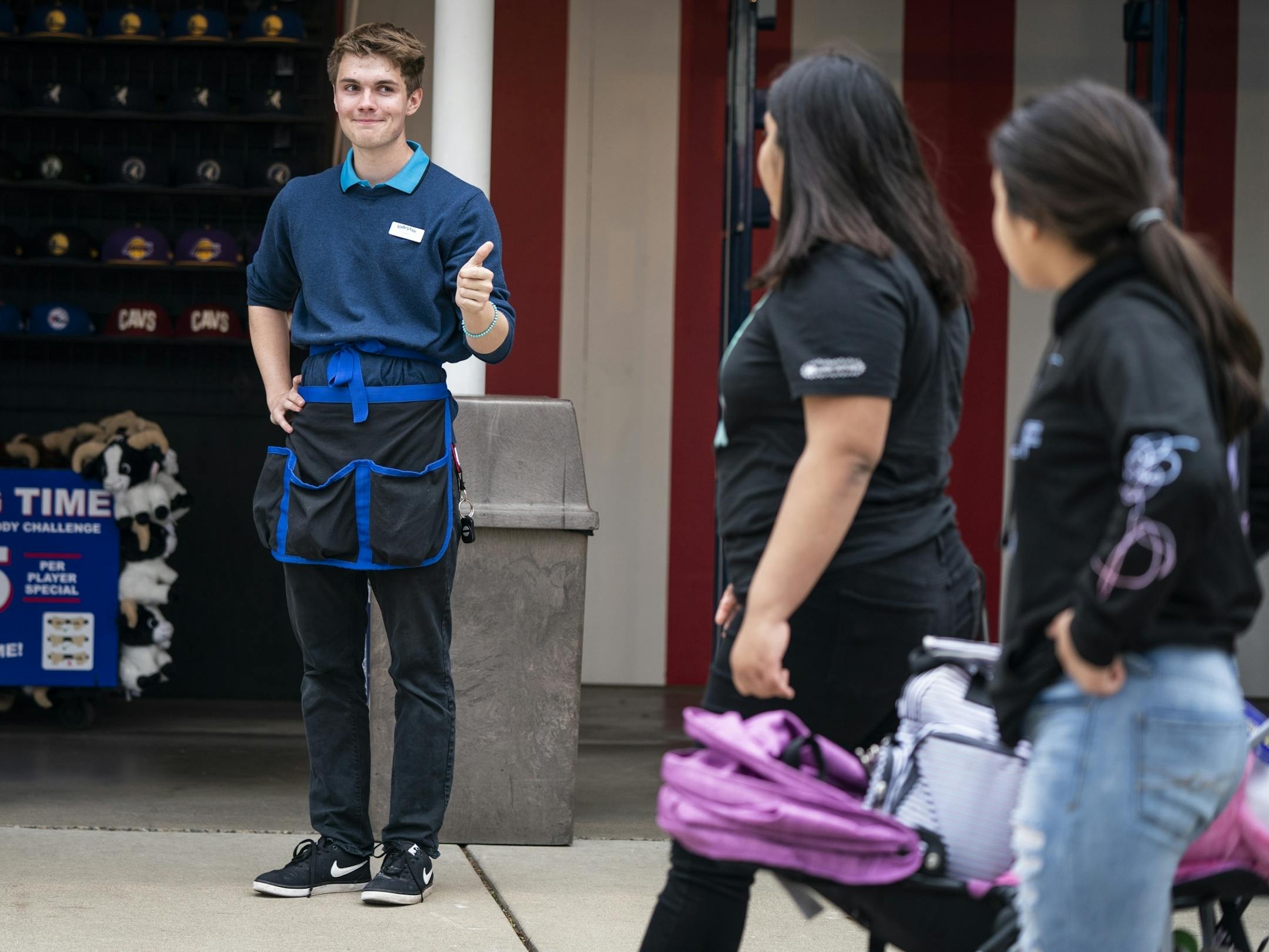Cole Boelter, 19, of Prior Lake, tries to entice customers to try Hang Time as he works in the games area of ValleyFair.