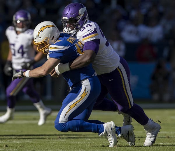 Minnesota Vikings' Jaleel Johnson (94) sacked Los Angeles Chargers quarterback Philip Rivers in the second quarter.