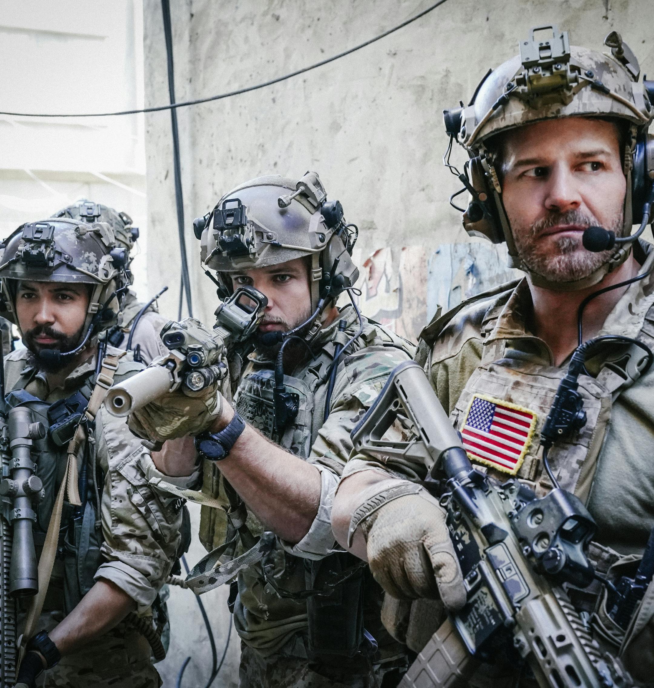 "Getaway Day" -- Jason and the SEAL Team must leave their families immediately when their deployment date is moved up after the team they were going to relieve is ambushed. Also, Jason and Alana make a big decision about their future, and Clay and Stella feel the weight of his marriage proposal, on SEAL TEAM, Wednesday, Jan. 31 (9:01-10:00 PM, ET/PT) on the CBS Television Network. Pictured left to right: Neil Brown Jr as Ray Perry, Max Thieriot as Clay Spenser, and David Boreanaz as Jason Hayes.