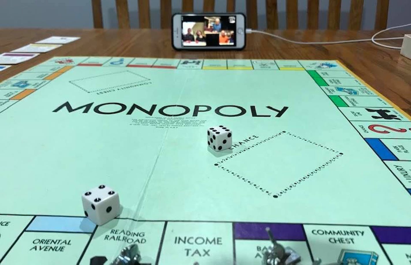 Phones caught the action as Carol Jackson rolled a 10 during a game of Monopoly she played with her siblings over Facebook Messenger.