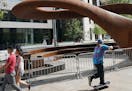 The 10-ton sculpture called 'Nibus' which rests outside the Hennepin County Central Library in downtown Minneapolis has been closed off by barricades 