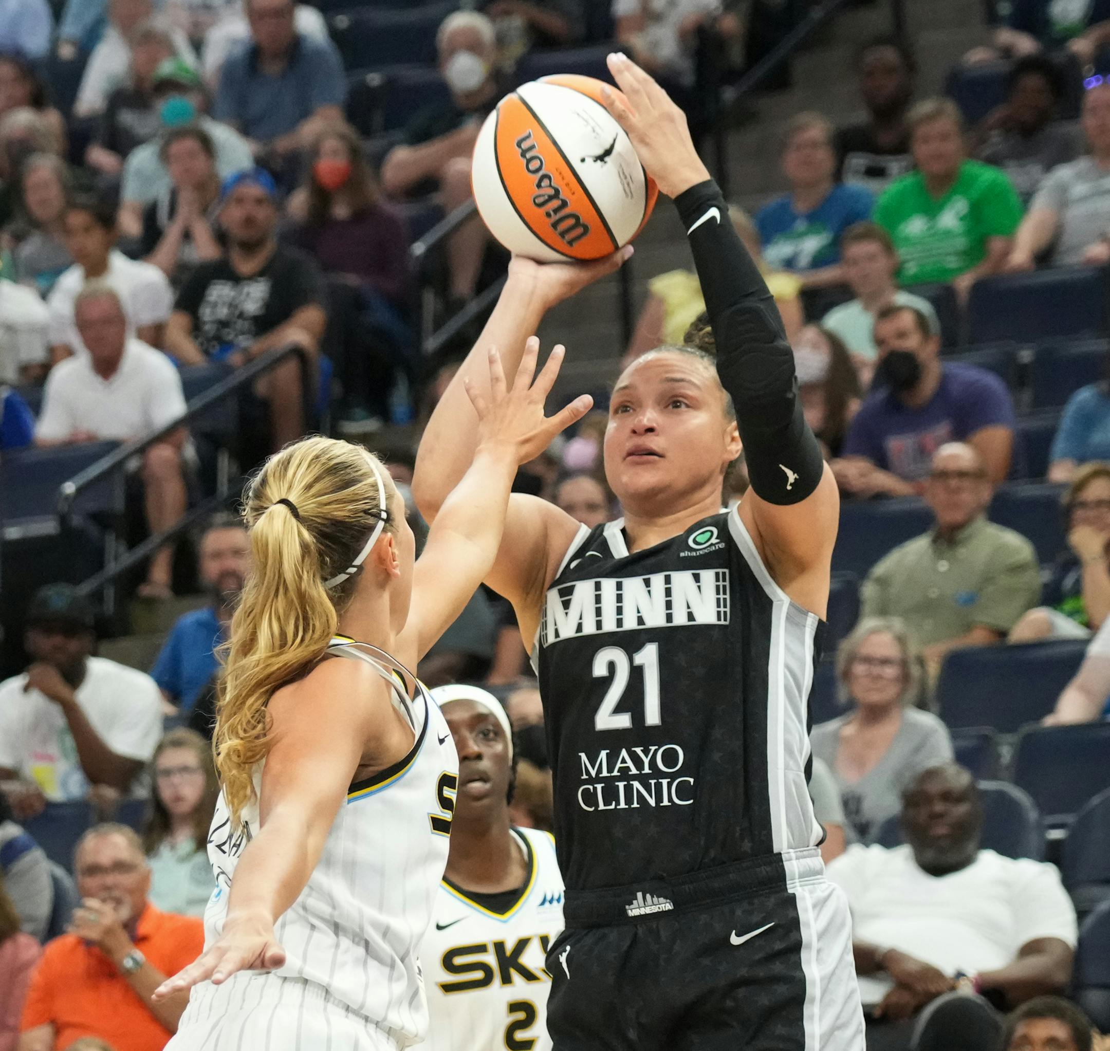 Minnesota Lynx guard Kayla McBride (21) gets a shot off above Chicago Sky guard Julie Allemand (20) in the second half.