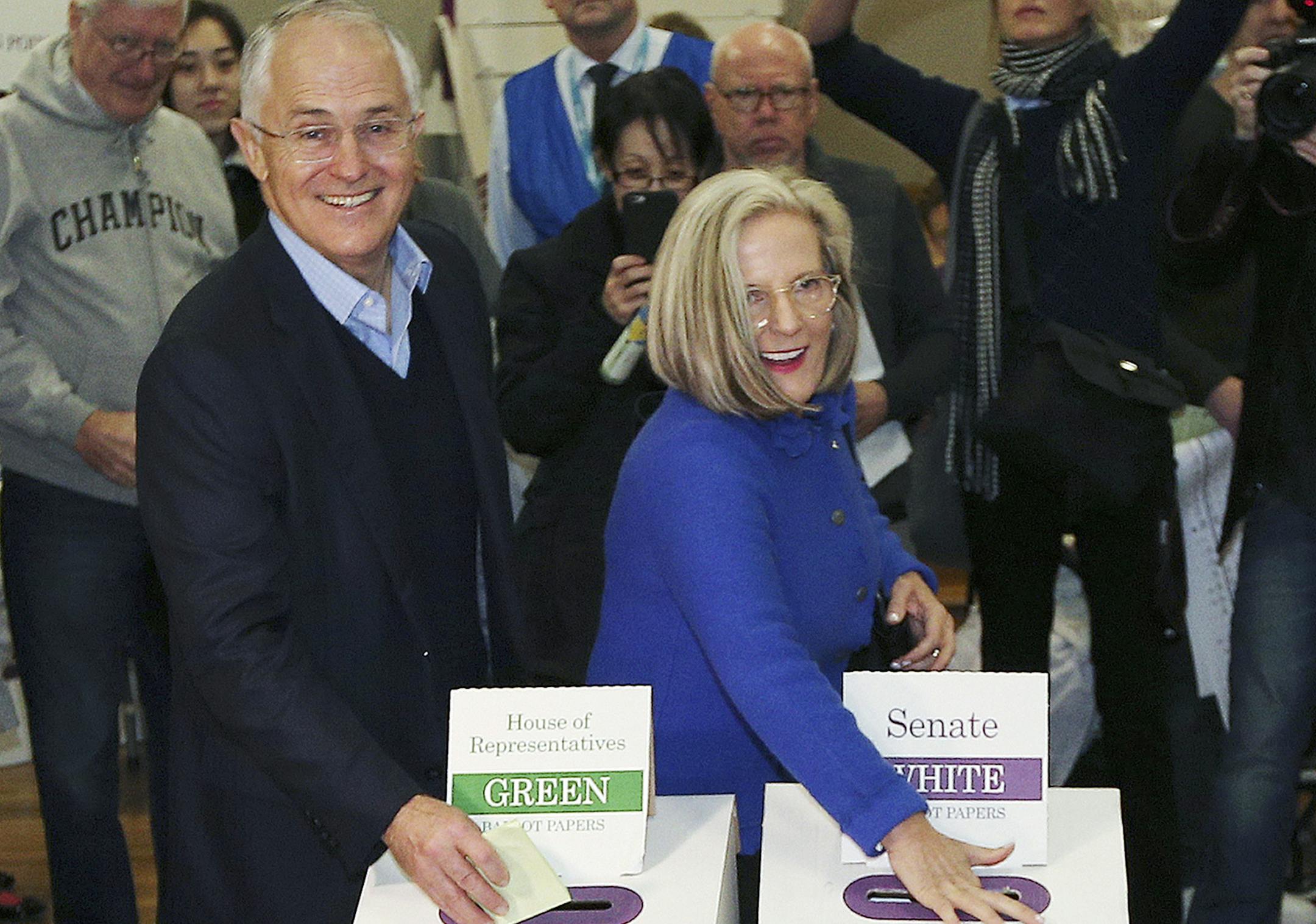 Australian Prime Minister Malcolm Turnbull, left, and wife Lucy cast their votes in the federal election at the Double Bay public school in Sydney, Australia, Saturday, July 2, 2016. After years of political turmoil, Australians headed to the polls on Saturday with leaders of the nation's major parties each promising to bring stability to a government that has long been mired in chaos. (AP Photo/Rob Griffith)