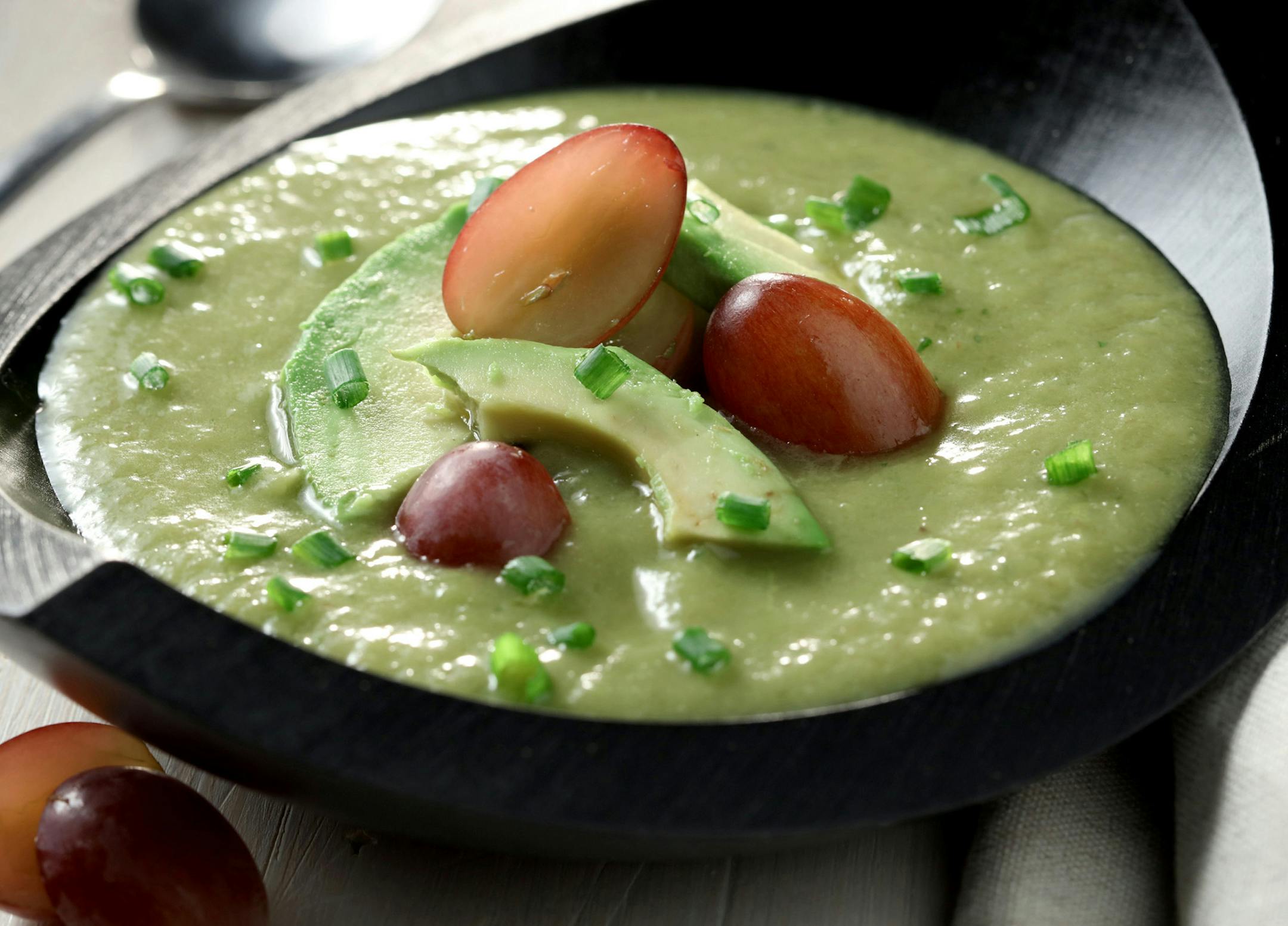 Upgrade the soup and sandwich combo with a cucumber and avocado gazpacho. Top it with red grapes, chives and more avocado. (Michael Tercha/Chicago Tribune/TNS) ORG XMIT: 1189792
