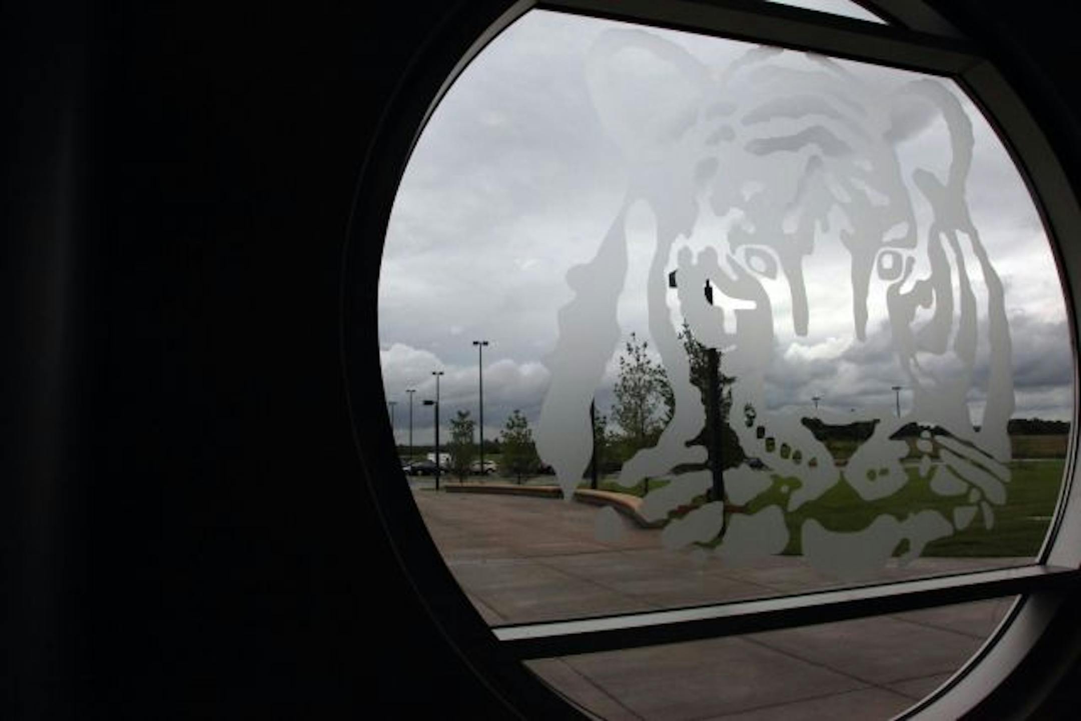 A window at Farmington High School depicts a tiger, the school's mascot.