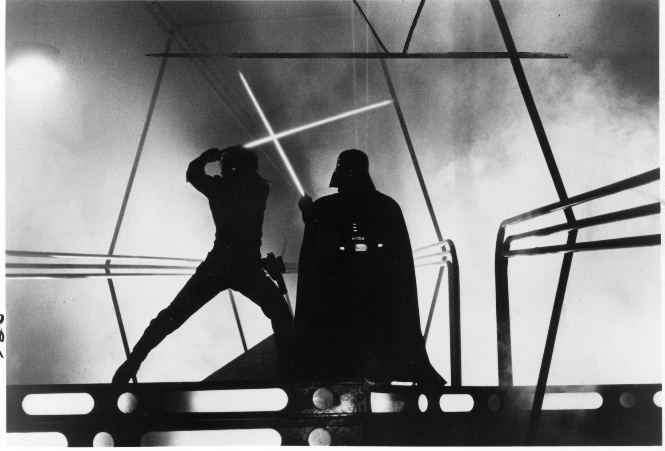 Luke Skywalker (played by Mark Hamill, at left) and Darth Vader (played by David Prowse, right) battle with lightsabers in the 1980 movie "The Empire Strikes Back," one of the Star Wars series of movies. Handout photo courtesy of Lucasfilm Ltd. and 20th Century Fox.