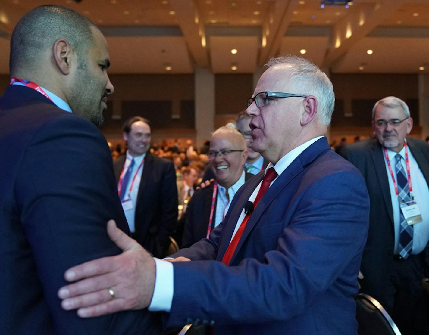 Gov. Tim Walz, an amiable executive shown here at a 2019 Minnesota Chamber of Commerce event, has made big, controversial proposals, but disagreed agreeably and shown a willingness to compromise on some spending issues with business lobbies. Photo: Star Tribune 2019