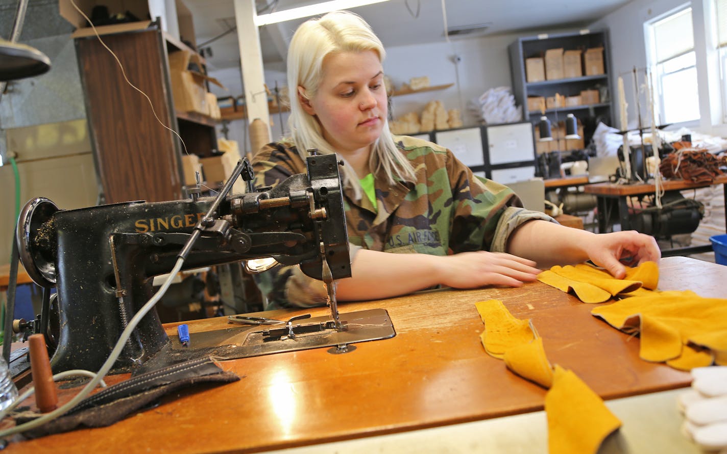 Taisha Voegele sews gloves at Century Leather Products in Owatonna, Minn. Founded in 1904 in Owatonna, the company historically has been known as Uber Glove and Tanning Co.