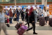 Travelers made their way through Terminal 2 at Minneapolis-St. Paul International Airport in Bloomington on Thursday.