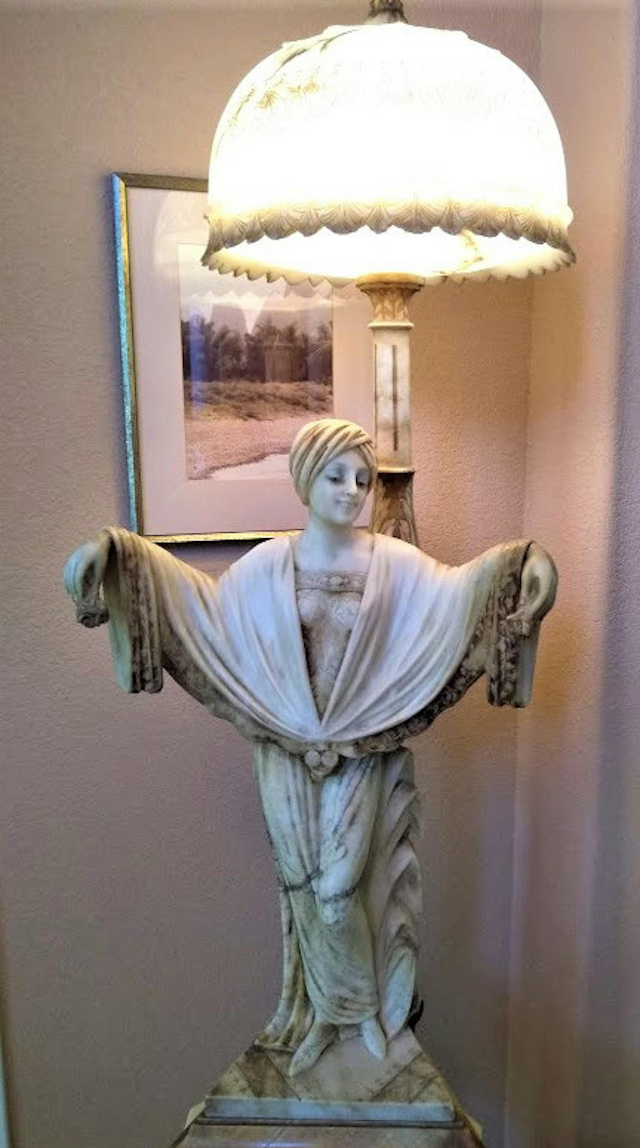 This beautiful lamp carved from alabaster was probably made in Italy. (Handout/TNS)