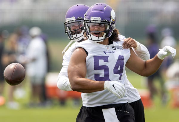 Minnesota Vikings linebackers Anthony Barr (55) and Eric Kendricks (54) worked on a ball stripping drill.