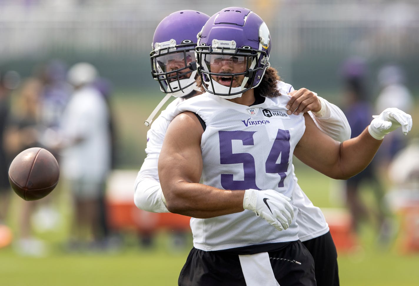 Minnesota Vikings linebackers Anthony Barr (55) and Eric Kendricks (54) worked on a ball stripping drill.