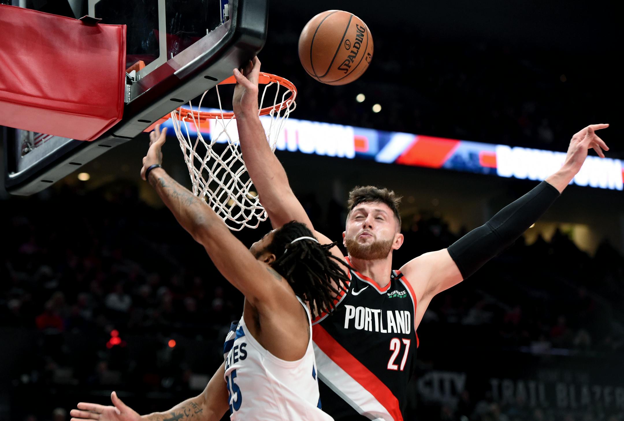 Portland Trail Blazers center Jusuf Nurkic, right, blocks the shot of Minnesota Timberwolves guard Derrick Rose during the first half of an NBA basketball game in Portland, Ore., Saturday, Dec. 8, 2018. (AP Photo/Steve Dykes)