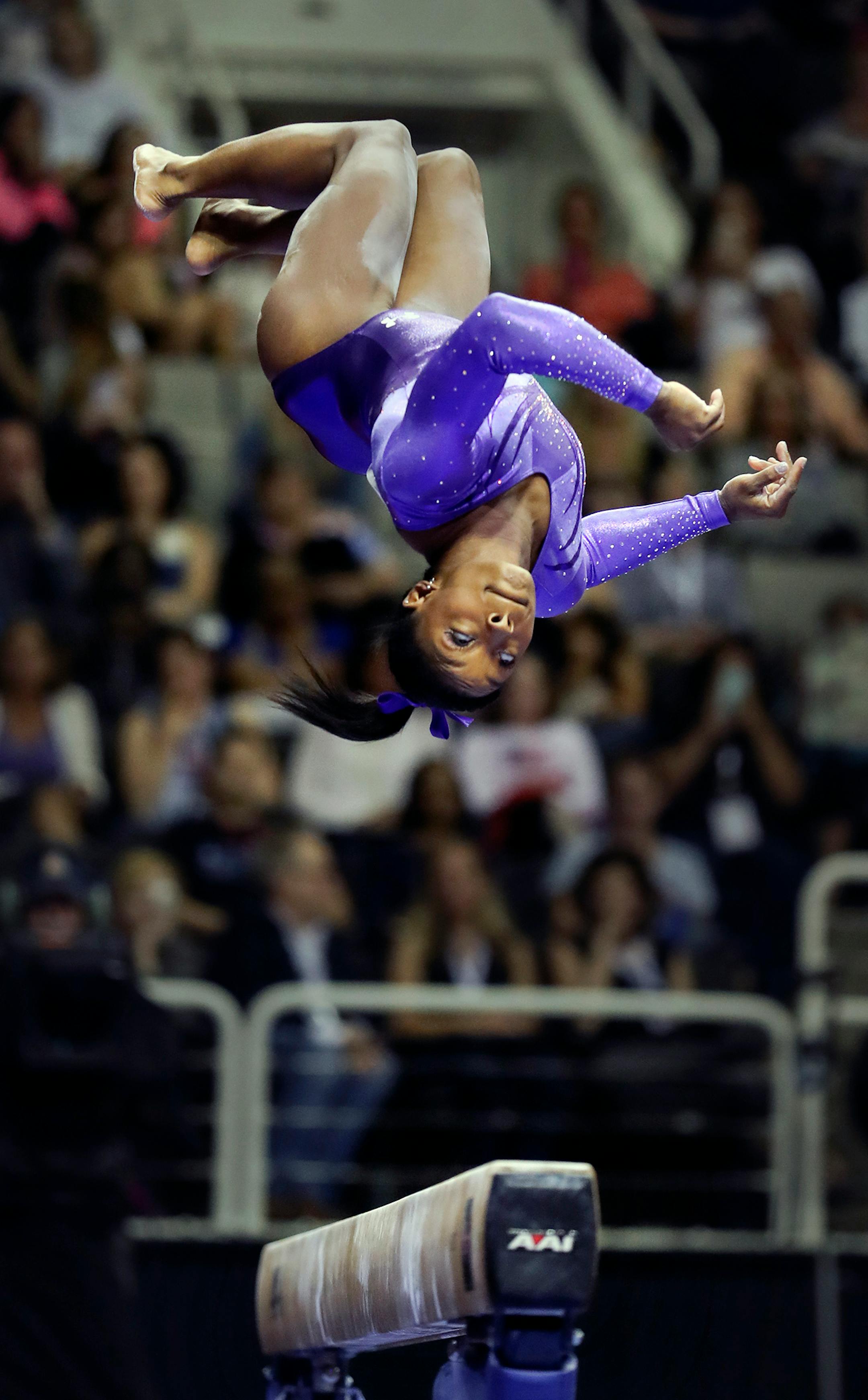 Day 1 - Simone Biles, keeps her eye on the beam during the first night of competition.